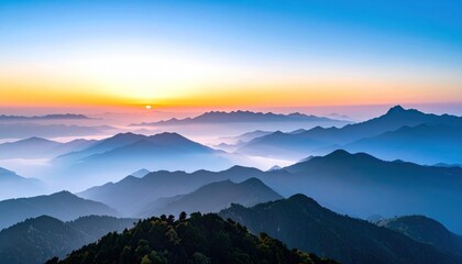 Serene vista featuring layers of mountains veiled in mist under a pastel sunrise sky, creating a peaceful and atmospheric landscape