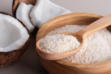 Organic coconut flour isolated on background, healthy gluten-free baking ingredient, natural tropical flour. 