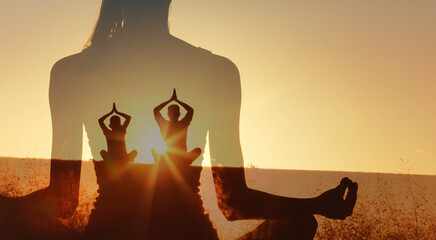 A double-exposure image shows two yoga silhouettes meditating in a field at sunrise. Warm light creates calm inner peace balance, and mindfulness, blending nature with peaceful fitness practice.
