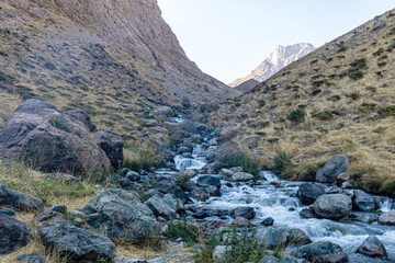 The scenic view of Reşko summit in the Sat (Cilo) mountains, Serpel and Horgedim plateau with its glaciers and glacier rivers in Hakkari, Turkey.
