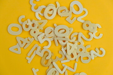 numbers on yellow background as a mathematics or calculation concept