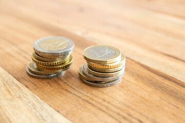 Metal coins stacks. Money on the wood table.