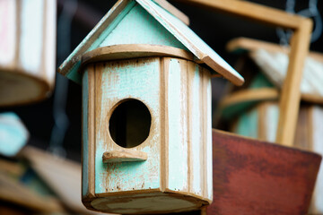 Colorful Wooden Birdhouse with Rustic Design and Natural Elements