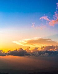 Fototapeta premium Sunset cloudscape, mountain vista, aerial view