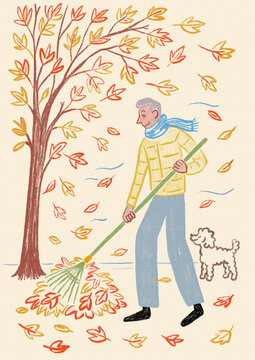 Man raking autumn leaves in windy garden