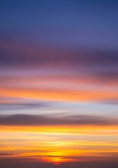 Fototapeta premium Beautiful layered sunset with vibrant colors illuminating the horizon