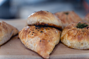 A plate of pastries with a variety of shapes and sizes