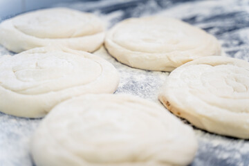 A close up of a doughnut with a lot of flour on it