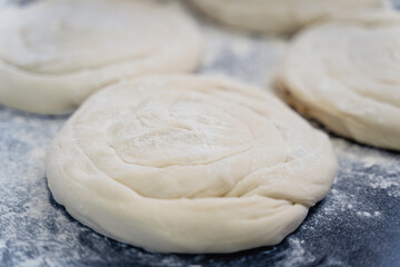 A close up of a doughnut with a lot of flour on it