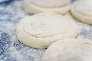 A close up of a doughnut with a lot of flour on it