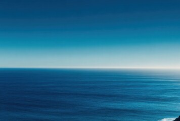 Fototapeta premium Azure sea meets a gradient cerulean sky, a peaceful ocean vista with subtle wave textures and serene, coastal vibes under a clear skyline