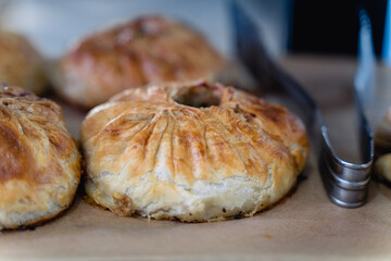 A pastry with a green topping sits on a table