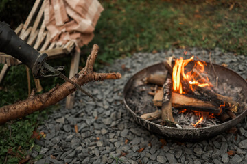 Cutting firewood for a campfire