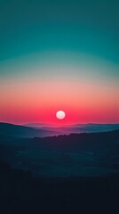 Fototapeta premium Sunrise over a misty valley. Blurred hills and a vibrant, sunset-like sun