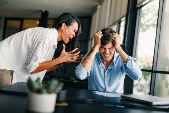 Colleagues arguing at workplace, executives disagree about papers, found error in contract