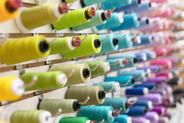 Close up of wall of thread spools