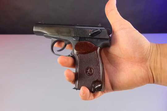 New makarov pistol in male hand individual weapon.