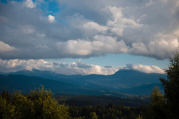 Fototapeta premium Mountain Landscape with Clouds and Greenery