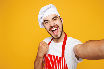Close up young housewife housekeeper chef cook baker man wears red apron toque hat doing selfie...