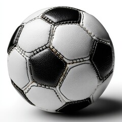 A classic black and white soccer ball resting on a gray background