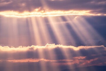 Stunning sun rays piercing through dramatic clouds over distant mountains inspiring hope and serenity in a majestic landscape scene