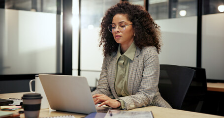 Finance, laptop and typing with business woman in office for administration or company management. Accounting, African and computer with financial manager in corporate workplace for budget review