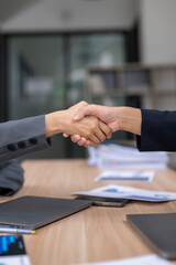 Business people shaking hands during a meeting in the office