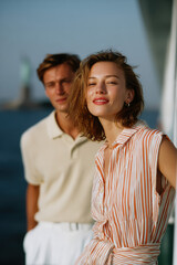 Elegant tourists enjoying a boat trip near the statue of liberty