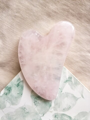 Rose quartz pink quasha flatlay top view closeup, beauty tools, anti age, natural, face massage 