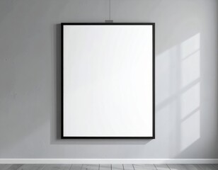 A minimalist, blank canvas in a black frame hangs on a light gray wall, highlighting the room's simple elegance and natural light.