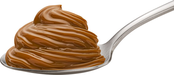 Caramel cream in spoon isolated