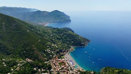 Aerial view backwards over the Bonassola village, sunny day in Liguria, Italy