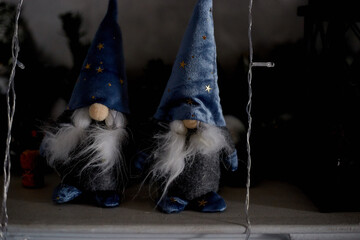 Two gnome toys on Christmas Eve evening