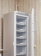 An open empty refrigerator