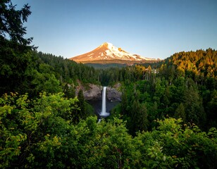 Waterfall cascading into lush valley at dawn