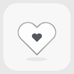 Heart symbol representing love and affection on a clean white surface, conveying a sense of simplicity and emotional connection.