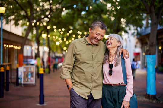 Happy mature couple laughing outdoors - Powered by Adobe