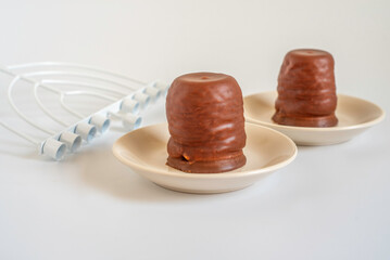 Israeli winter dessert Krembo for Jewish holiday Hanukkah on white background.
