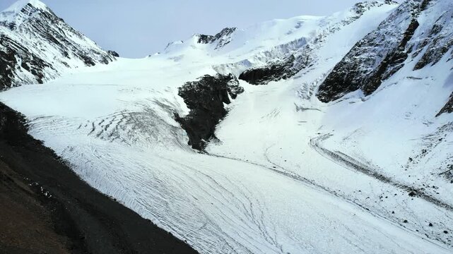 Majestic glacier melting in the vast mountain range. Media