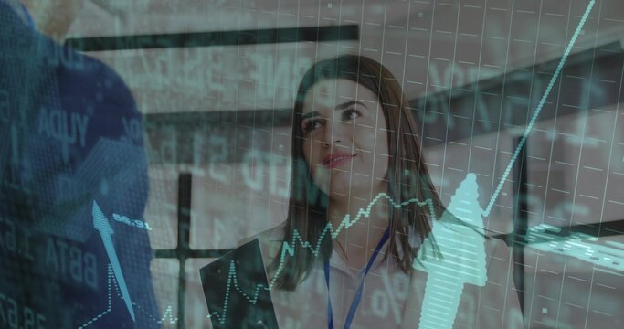 Executive in blazer listening to colleague with overlaid financial charts in office, with ID badges