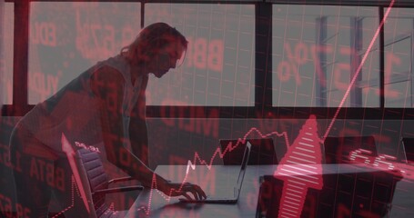 Leaning woman in gray top using laptop in boardroom, red graph overlays, upward arrow, copy space
