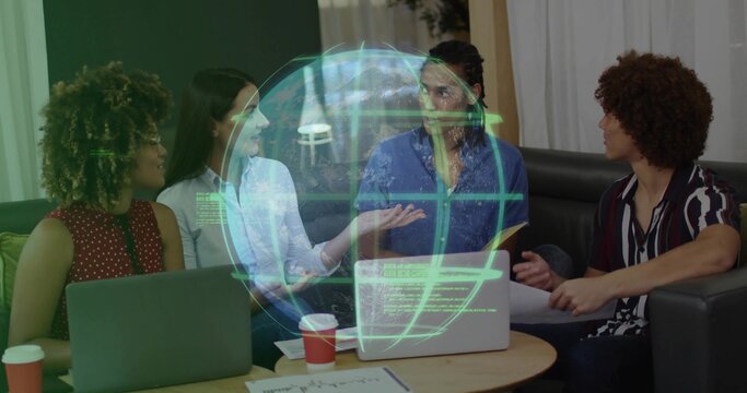 Colleagues collaborating around table in office with laptops, documents, digital globe projection