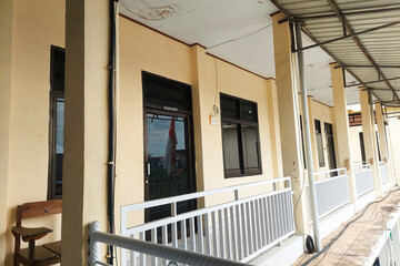 White Classroom Building with two floors showing the walls