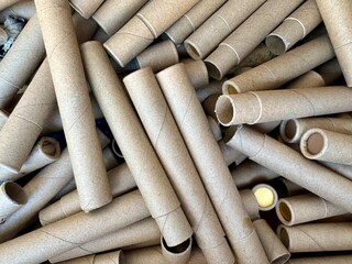 Stack of empty cardboard tubes ready for recycling or reuse in eco friendly packaging