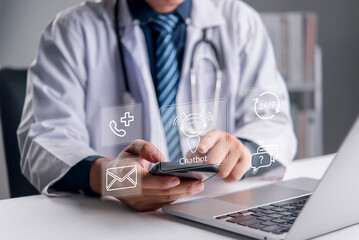 Healthcare, Chatbot. A doctor uses a smartphone beside a laptop with medical contact icons to access. AI chatbot for 24/7 assistance, telemedicine, patient support, and digital health concept.