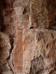 Close up of an old rough, stony wall.