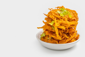 Vegetable pancakes or latkes for Jewish holiday Hanukkah on white background. Free space for text.
