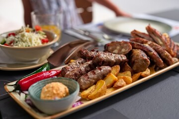 Closeup of traditional minced meat dish with vegetables on the table