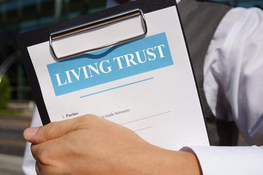 Living trust and Estate Planning is shown on the conceptual business photo