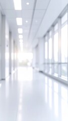 An out-of-focus hallway features bright light pouring through side windows, creating a smooth, luminous atmosphere